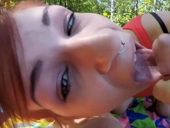 Outdoor sex at the lake with a red-haired slut