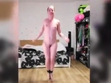 Naked girl jumps rope with ankles and toes tied